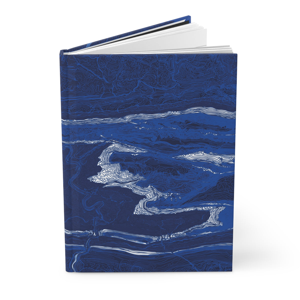 The Fall Line hardcover journal standing partly open, showing its blue map-patterned cover.