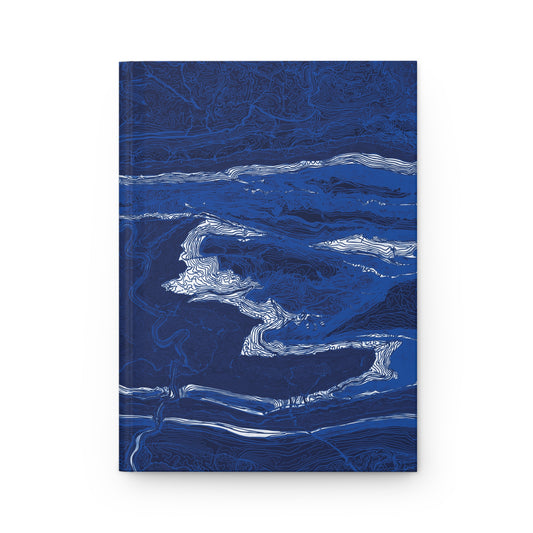 Front cover of The Fall Line journal with white contour lines across a deep blue map-inspired design.