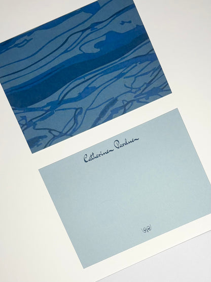 Close-up of Thrust Belt stationery showing a blue geological pattern and a pale blue personalized writing side.