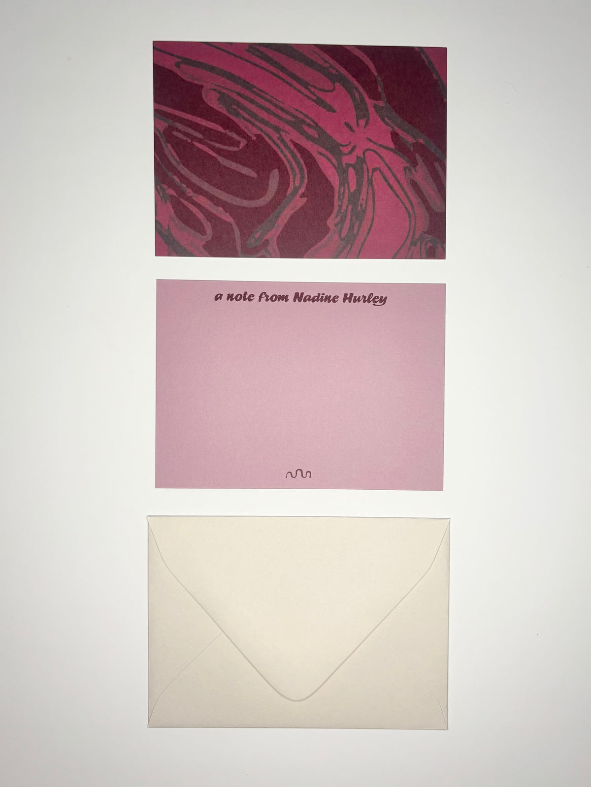 Oxbow stationery set showing a wine purple river-patterned back, personalized purple front, and cream envelope.