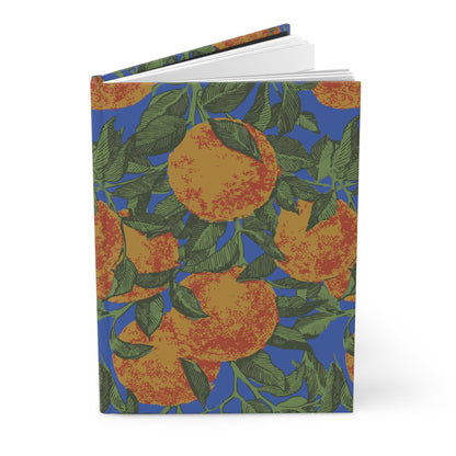 Orange Grove hardcover journal standing partly open, showing its citrus-patterned cover.