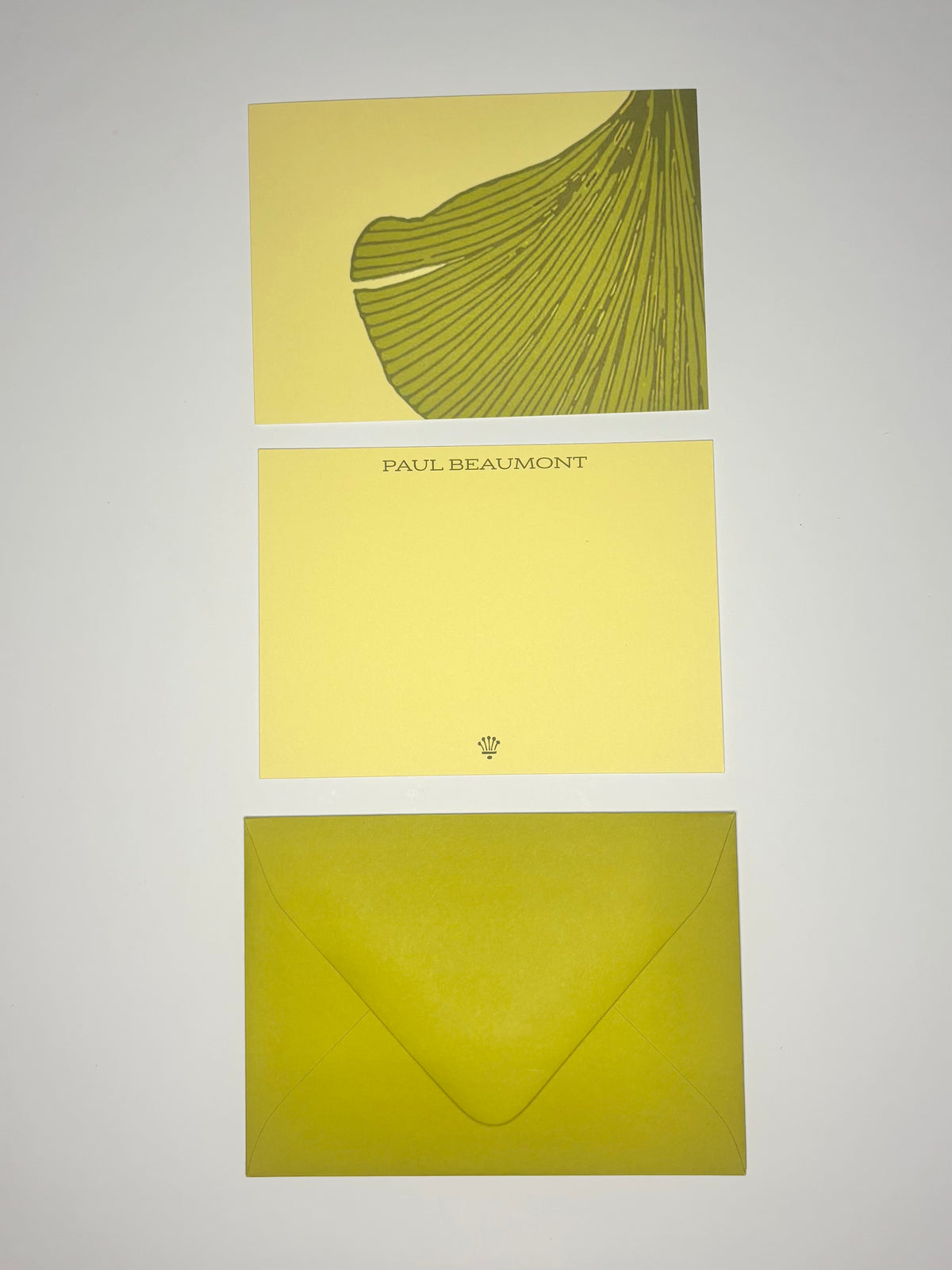 Maidenhair Fern stationery set showing yellow card fronts and backs with a green leaf design and coordinating envelope.