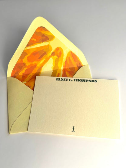 Orange You Glad personalized cream notecard with an open pale yellow envelope lined in an orange slice design.